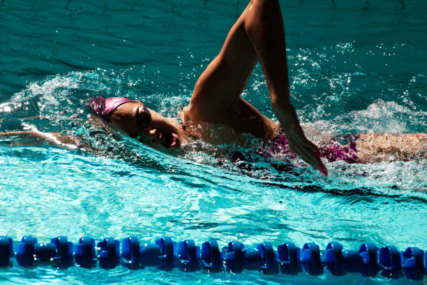 istock Young woman swimmer training in the pool. 1443322842