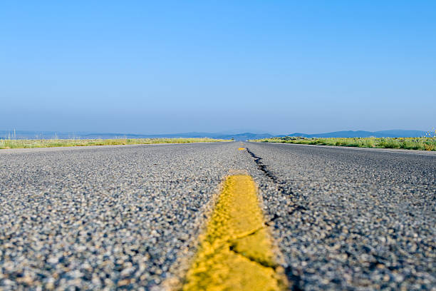 istock Surface Level Two Lane Highway Stripe Rural New Mexico, USA 144332342