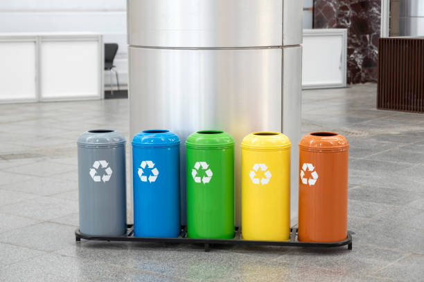 Colored trash containers for garbage separation stock photo