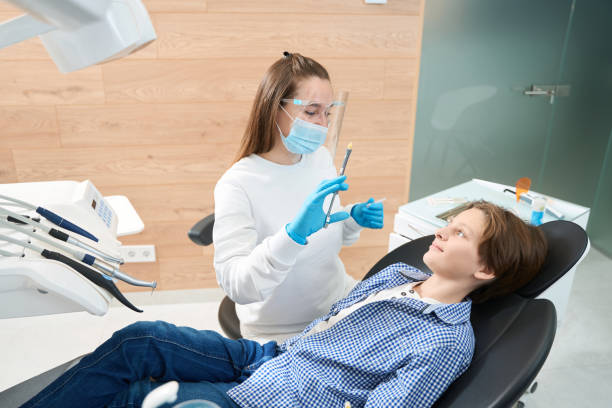 istock Woman dentist is holding syringe with anesthesia 1443325052