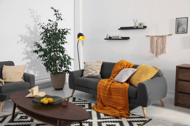 istock Stylish living room interior with comfortable sofa and wooden table 1443327136