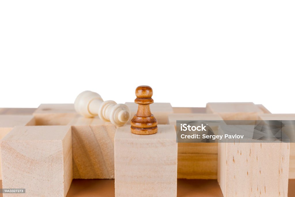 black pawn defeating the white king a black pawn towering over a defeated white king on a relief board Aggression Stock Photo