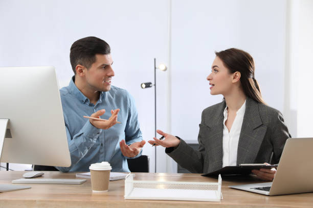 istock Businesswoman helping intern with work in office 1443327280