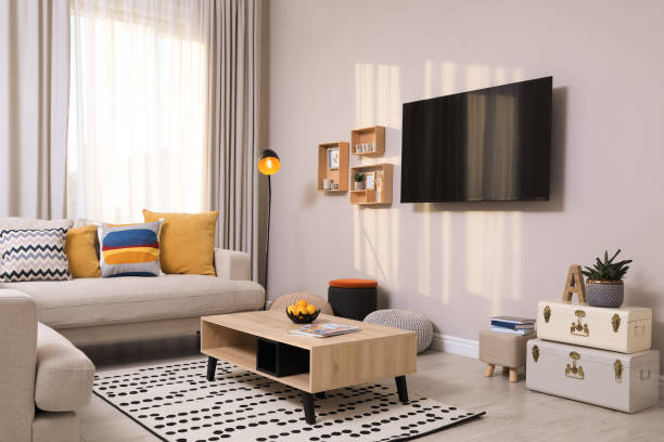 istock Modern TV, comfortable sofa and decor elements in living room 1443327558