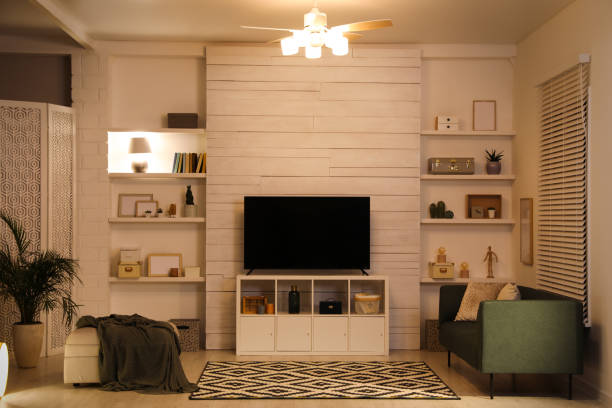 istock Modern TV on cabinet, comfortable sofa and decor elements in living room 1443327638