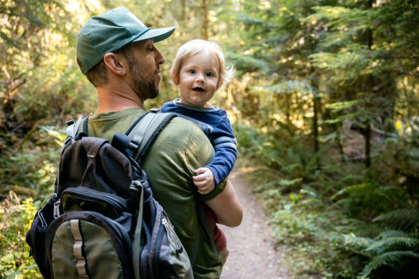 Father Hiking With Toddler In Washington State Forest