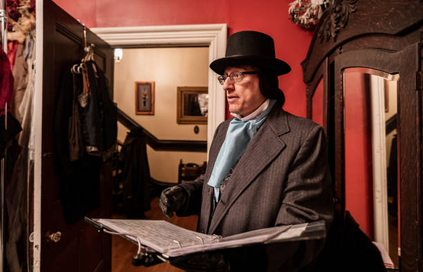 istock Mature man getting dressed for Christmas carolling 1443328324