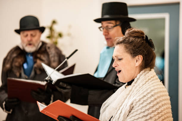 istock Mature people practising singing for Christmas carolling 1443328593