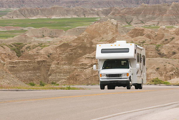 RV class C climbing scenic mountain road in the Badlands stock photo
