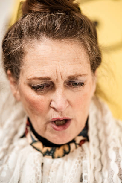 istock Mature woman practising singing for Christmas carolling 1443328611
