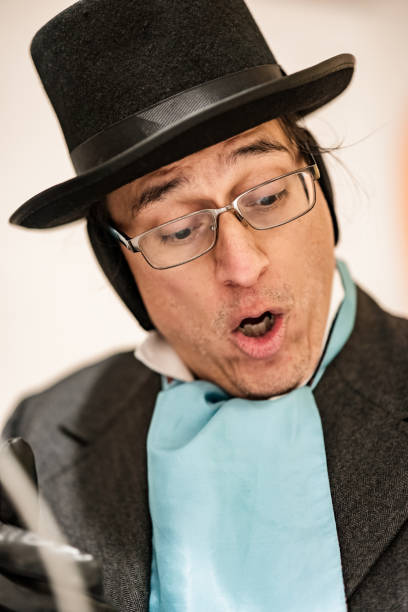 istock Mature man practising singing for Christmas carolling 1443328618