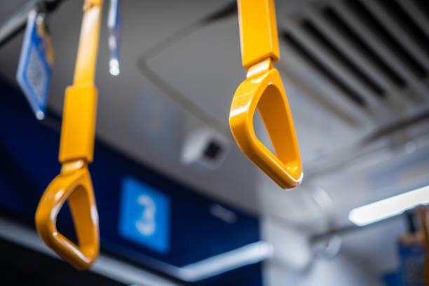 Yellow Handlegrip in Public Transportation stock photo