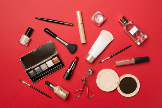 istock Different makeup products on color background, top view 1443330462