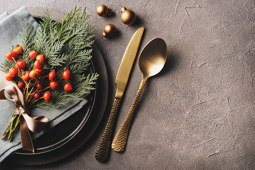 Christmas dinner with gold cutlery and decoration