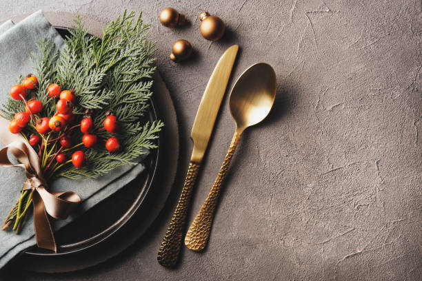Christmas Dinner Christmas dinner with gold cutlery and decoration winter food top view stock pictures, royalty-free photos & images