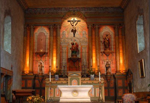 Candles in the foreground of the altar of the Notre-dame Basilica in Montreal. The basilica in located in the old part of town, Vieux Montreal.