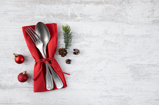 Holiday background with vintage place setting on old wooden table