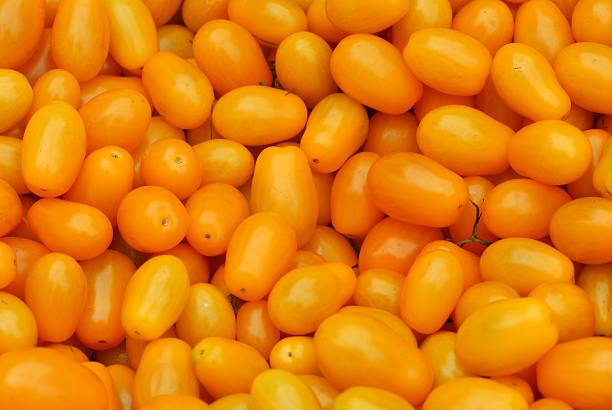 istock Orange Tomatoes at a Farmer's Market II 144333668