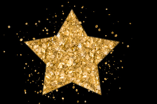 Star and golden particles black background, copy space