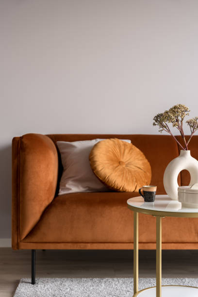 istock Elegant, ocher colored sofa and decorations, close-up 1443338471