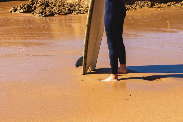 istock Young woman surfer 1443339018