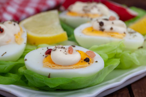 istock Eggs with mayonnaise on green lettuce leaf. 1443340696