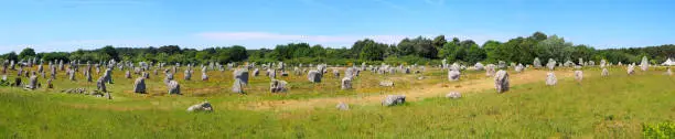 Panoramic view of the alignments of menhirs of Carnac, a famous Neolithic UNESCO World Heritage site located in Brittany in western France.