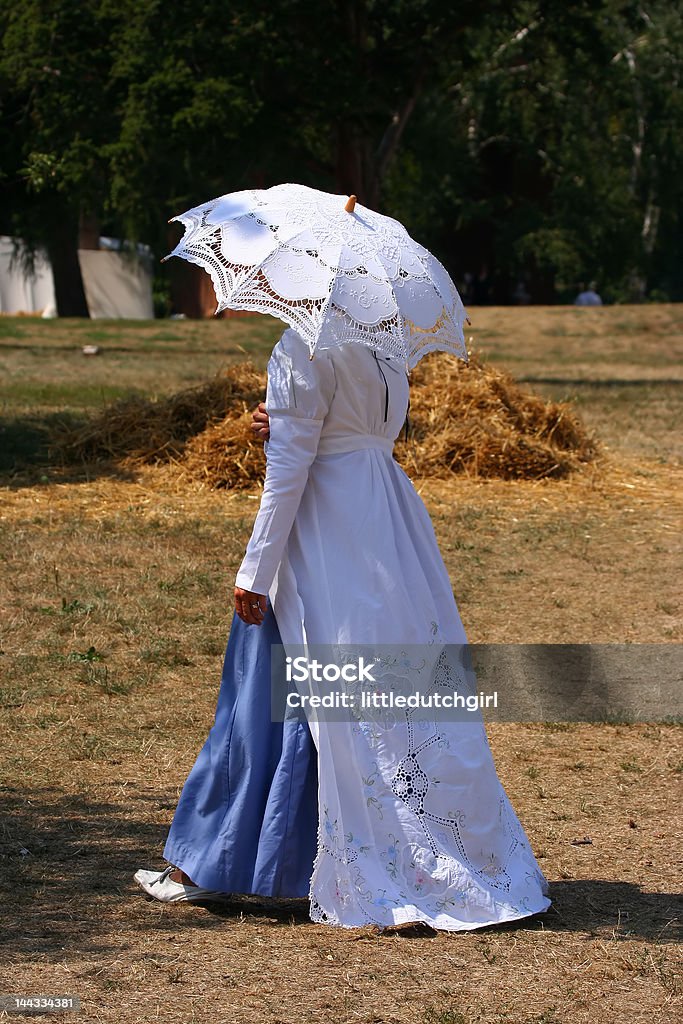 War of 1812 re-enactment Woman at a War of 1812 battle re-enactment walking Agricultural Field Stock Photo