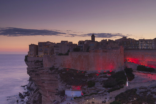 illuminated old town of Bonifacio in Corsica perched on the cliffs; Bonifacio, France