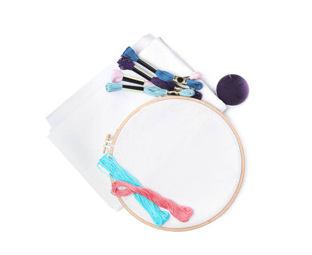 istock Colorful threads and different embroidery accessories on white background, top view 1443346043
