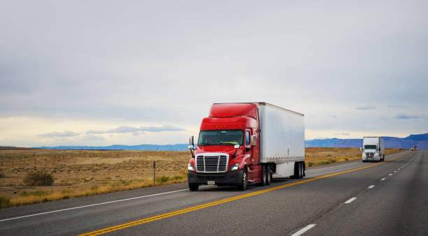 istock Red and white long haul semi in Utah, USA 1443350552