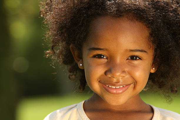 Child Smiling little black girl hairstyle stock pictures, royalty-free photos & images