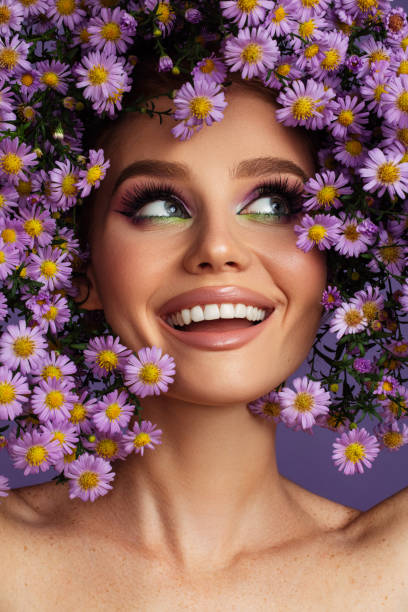 Young beautiful girl with wreath of flowers on her head stock photo