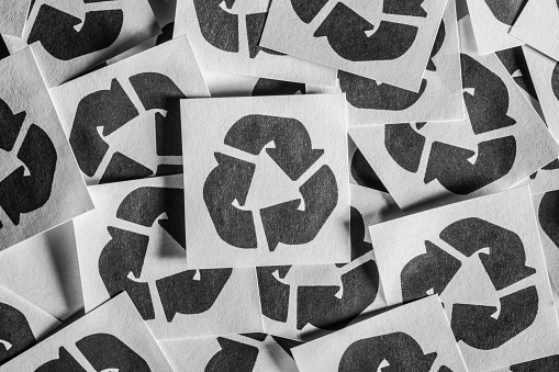 Group of paper icons with the recycling symbol