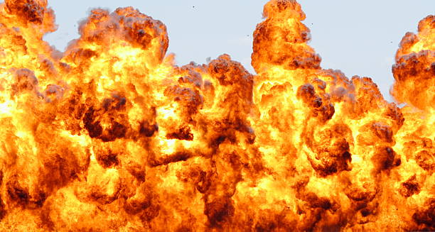istock Large hot explosion, debris can be seen in sky 144335500