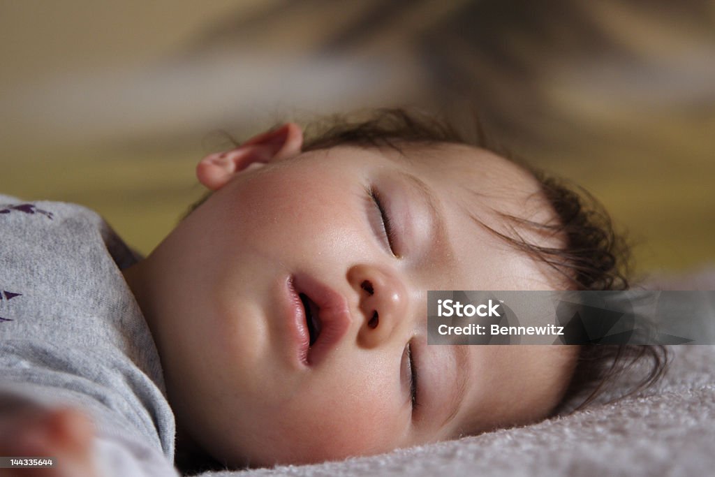 Sleeping baby lying on a gray blanket - Royalty-free Baby Stockfoto