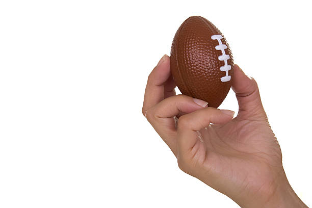 istock Hand holding rugby ball 144335671
