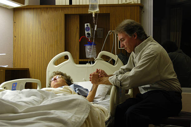istock Praying in Hospital 144336167