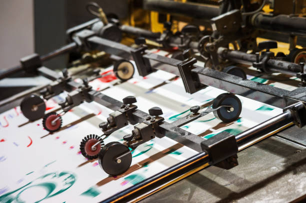 istock Printing house. Printing equipment. Machine for varnishing printed products. Processing after offset printing. 1443362464