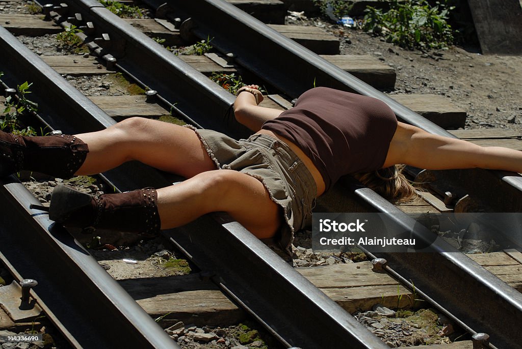 Cowgirl on a railroad 3 It can be used for suicide concept. Camera: Nikon D200, lens: Sigma 70-200 APO Dead Person Stock Photo