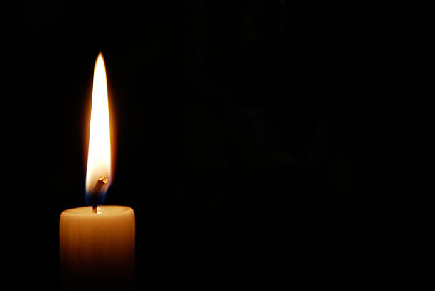 Candle in the dark White candle burning in the dark candlelight stock pictures, royalty-free photos & images