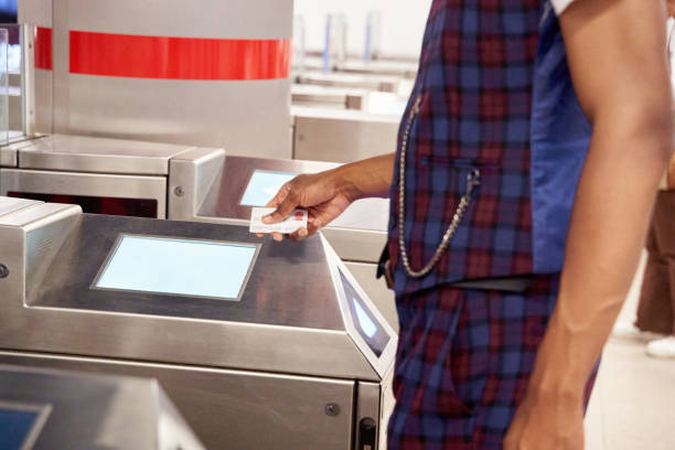 istock unrecognizable man passing the entrance ticket to a subway station 1443375470