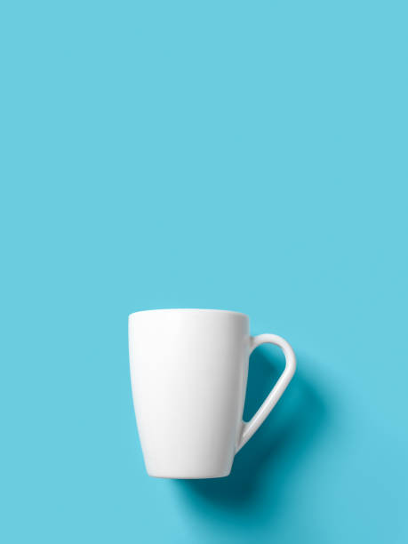 istock White cup over blue background. Empty mug against turquoise surface. Large cup mockup for breakfast design. Crockery for hot beverages. Modern tableware concept. Copy space. 1443378083