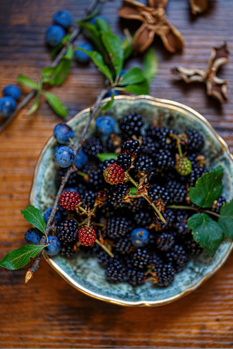 picture with wicker basket and blueberry berries, harvest time, big blueberries, berry picking time