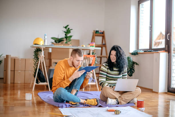istock Young couple planning home renovation 1443378848