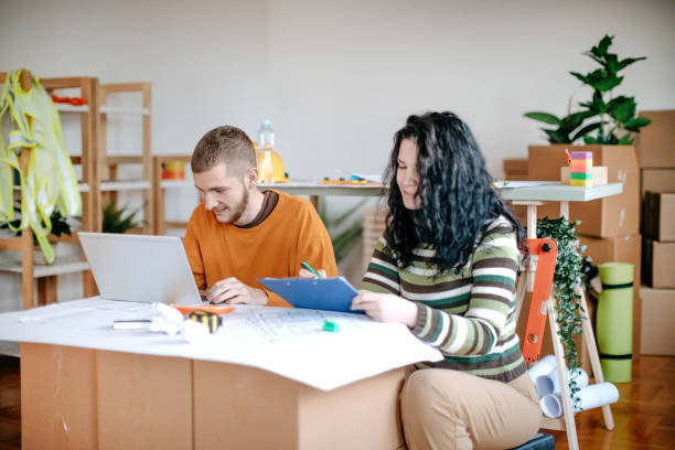 istock Young couple planning home renovation 1443378881