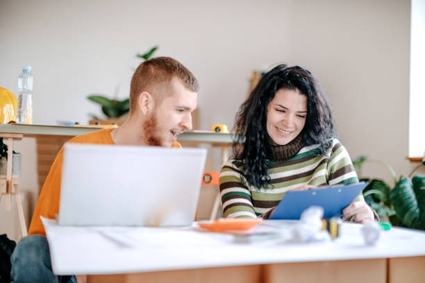 istock Young couple planning home renovation 1443378928