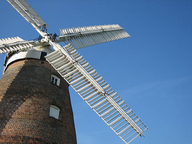 Black brick and white wooden windmill.
