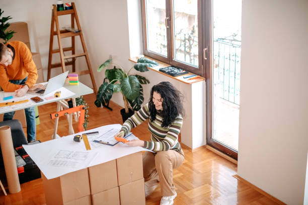 istock Young couple working together on finding best solution for new apartment 1443381305