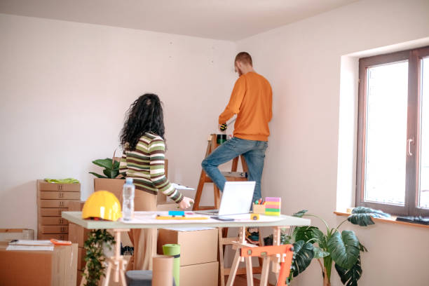 istock Young couple working together on finding best solution for new apartment 1443381308